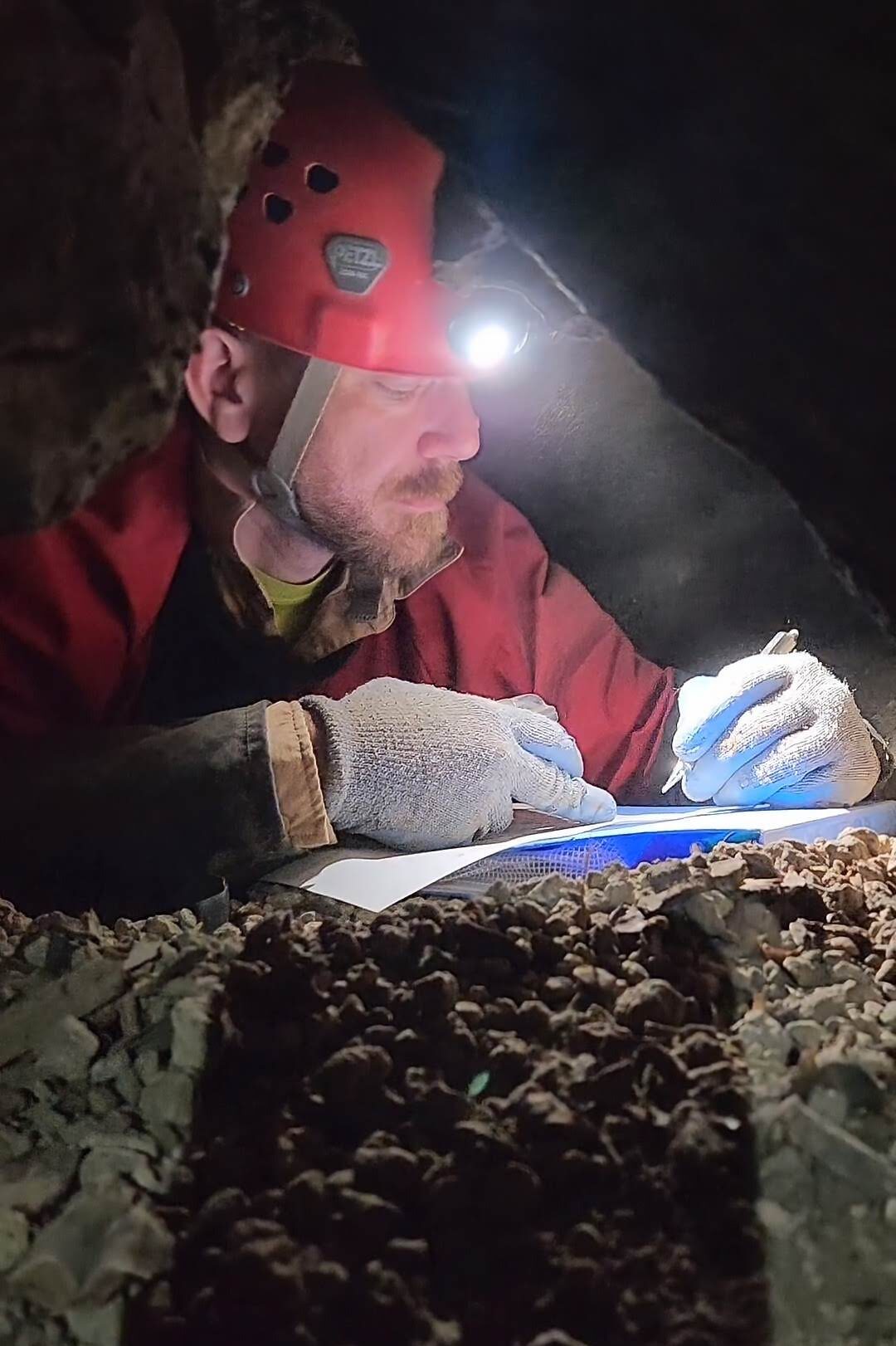 Lonnie Drafting inside a cave.